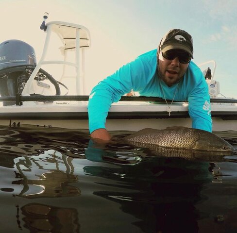Captain Craig displays his catch.